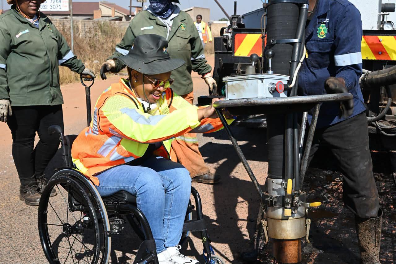 Picture of DG Ms. Maggie Skosana doing her part during the Mandela Day commemoration in Thembisile Hani Local Municipality